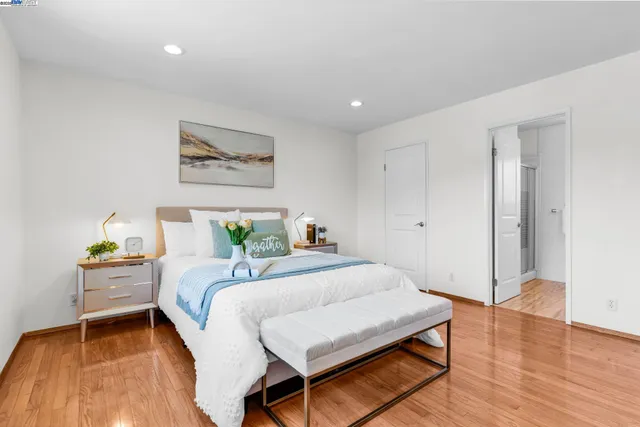 a bedroom with a bed and a table