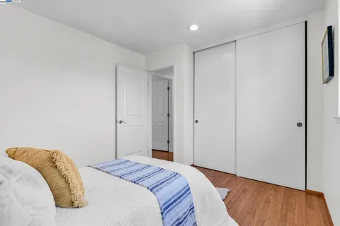 a bedroom with a bed and a dresser