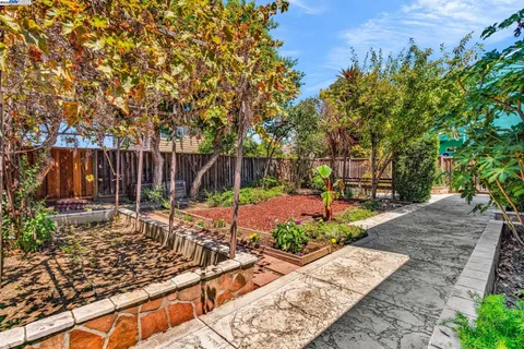 a view of a backyard with sitting area