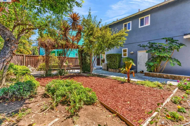 a view of a backyard with a garden