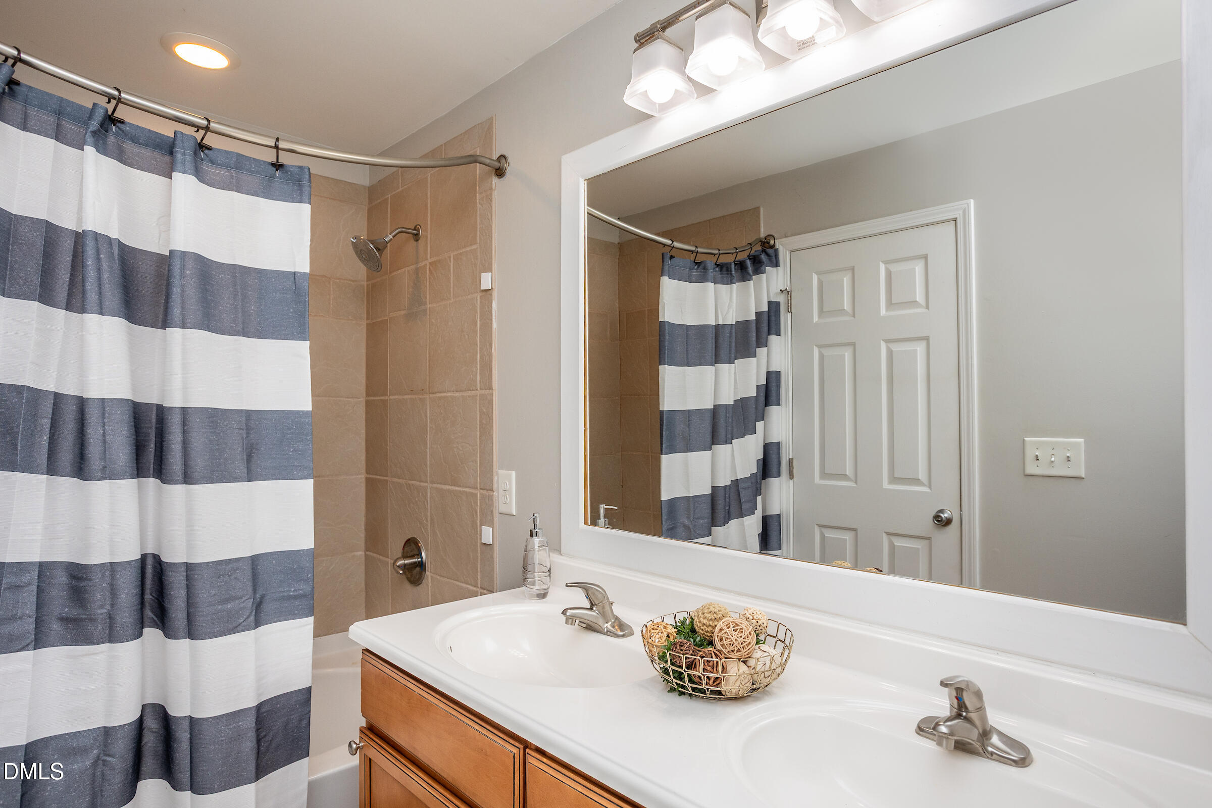 305 Freeman Street Raleigh, NC 27601 - Photo 11 of 15 a bathroom with a sink a toilet a shower and a mirror
