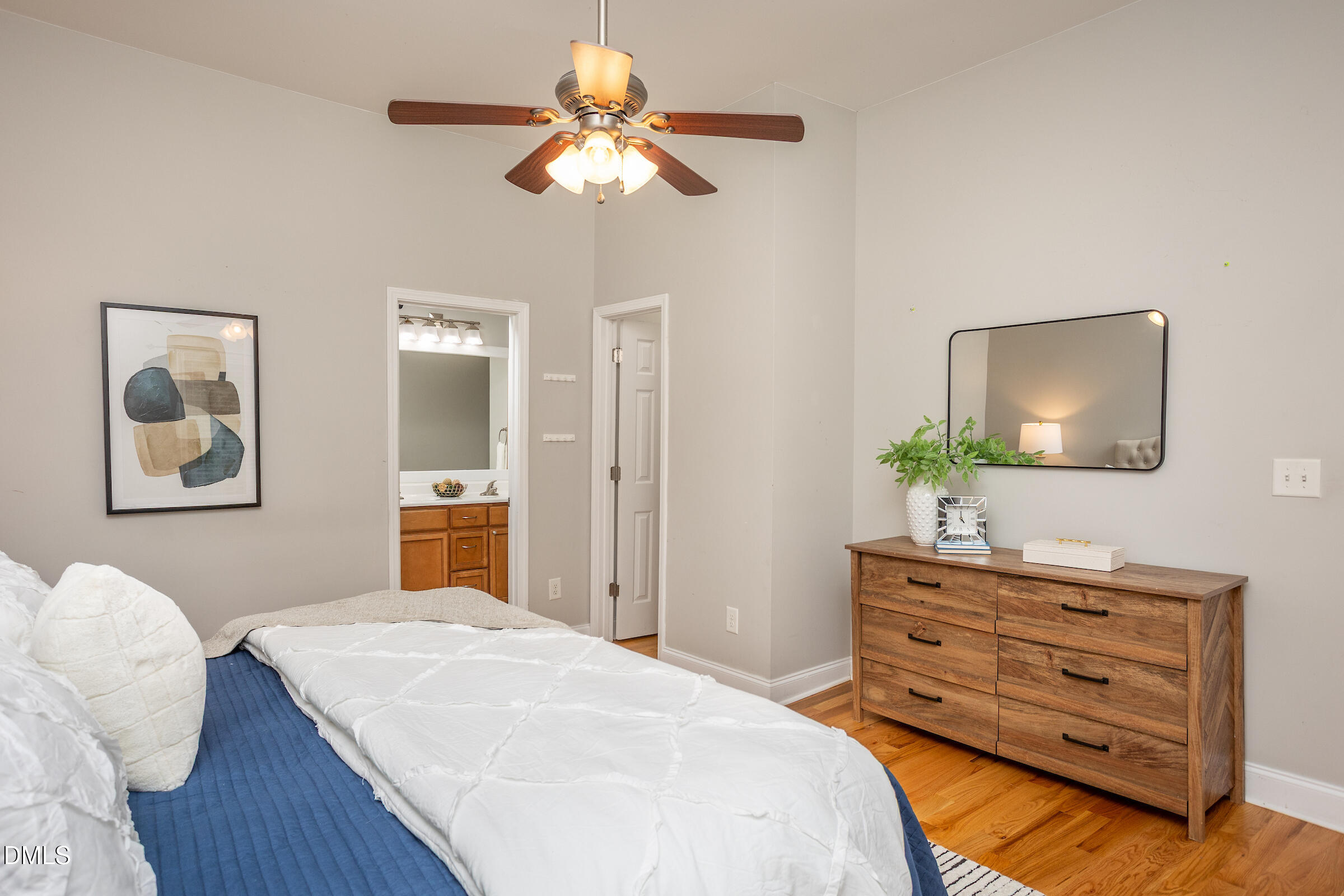 305 Freeman Street Raleigh, NC 27601 - Photo 10 of 15 a bedroom with a bed and a dresser