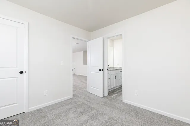 an empty room with white cabinet