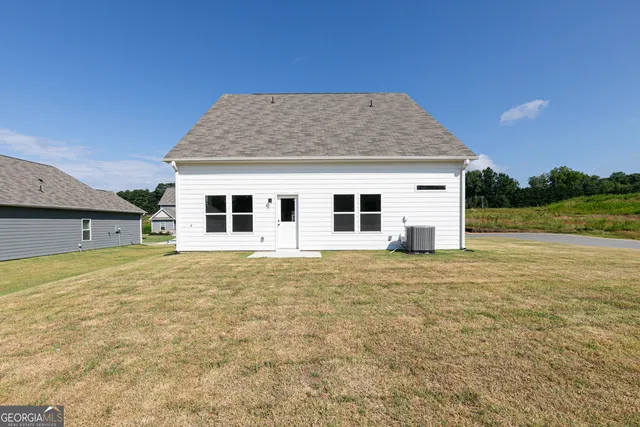 a house with yard in front of it