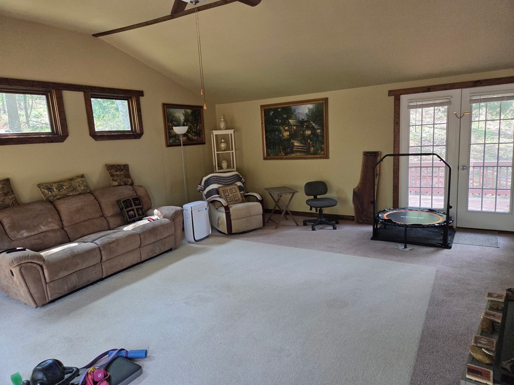 208 Ledford Chapel Road Hayesville, NC 28904 - Photo 19 of 35 a living room with furniture gym equipment and a window