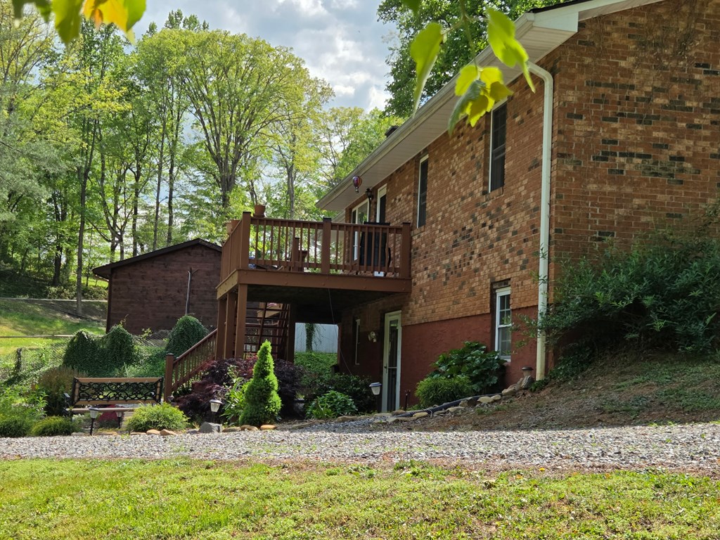 208 Ledford Chapel Road Hayesville, NC 28904 - Photo 2 of 35 a front view of a house with garden