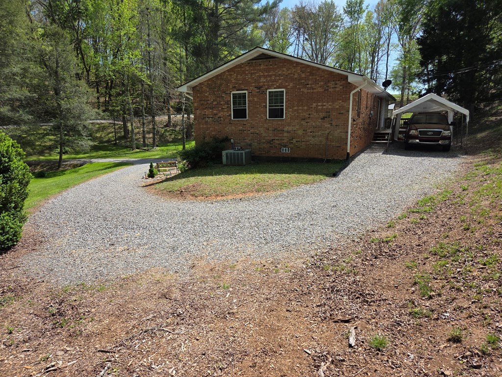 208 Ledford Chapel Road Hayesville, NC 28904 - Photo 25 of 35 a view of a house with a yard