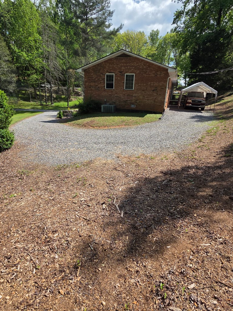 208 Ledford Chapel Road Hayesville, NC 28904 - Photo 3 of 35 a front view of a house with a yard