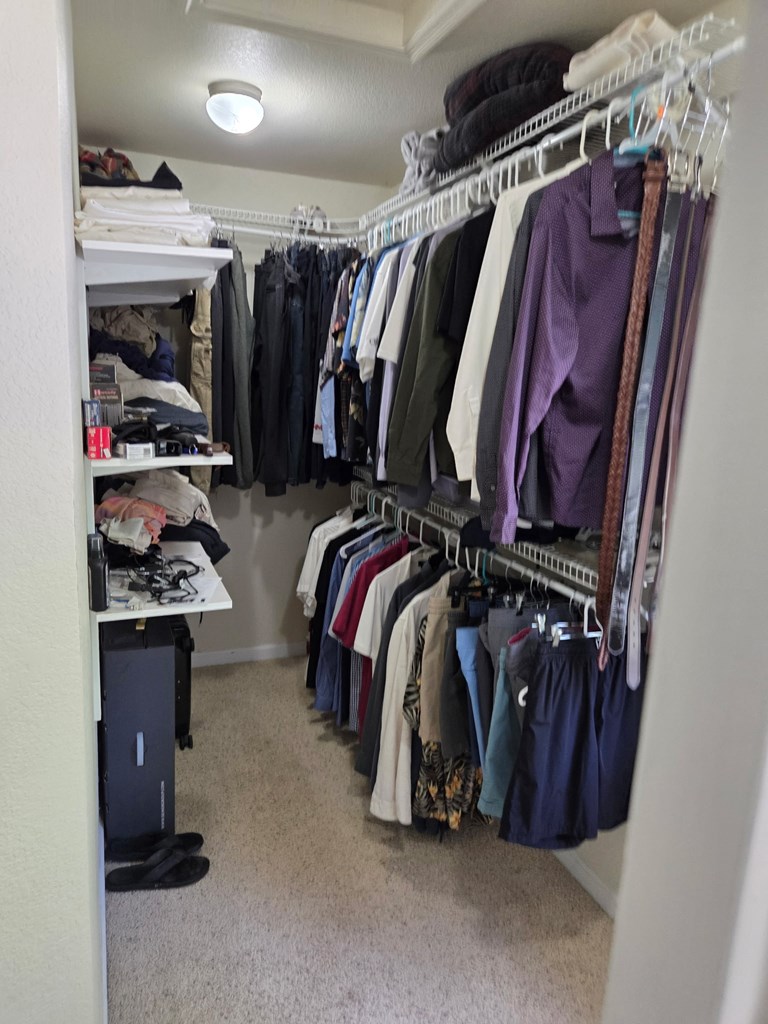 208 Ledford Chapel Road Hayesville, NC 28904 - Photo 32 of 35 a view of walk in closet with clothes and shoes