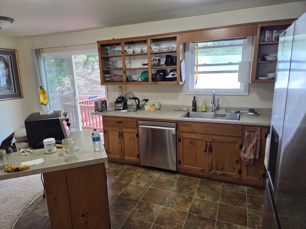 208 Ledford Chapel Road Hayesville, NC 28904 - Photo 10 of 35 a kitchen with a sink stove and cabinets