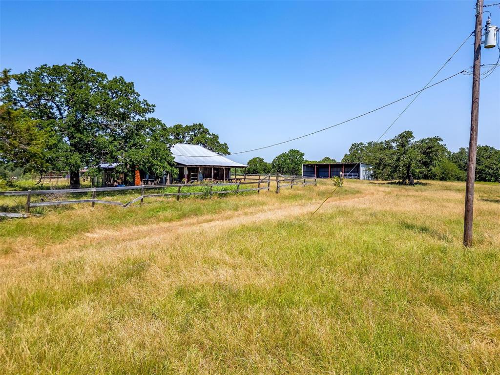 210 Trails End Poolville, TX 76487 - Photo 24 of 25 a view of a swimming pool with an outdoor space and seating area