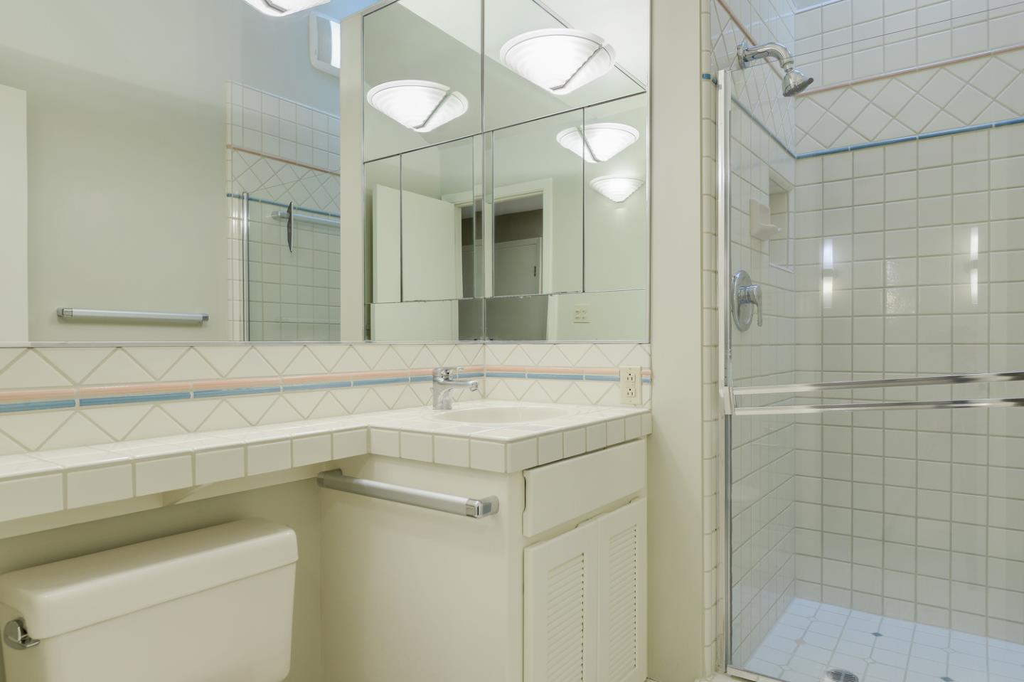 390 Cherry Avenue Los Altos, CA 94022 - Photo 15 of 27 a bathroom with a sink and a mirror