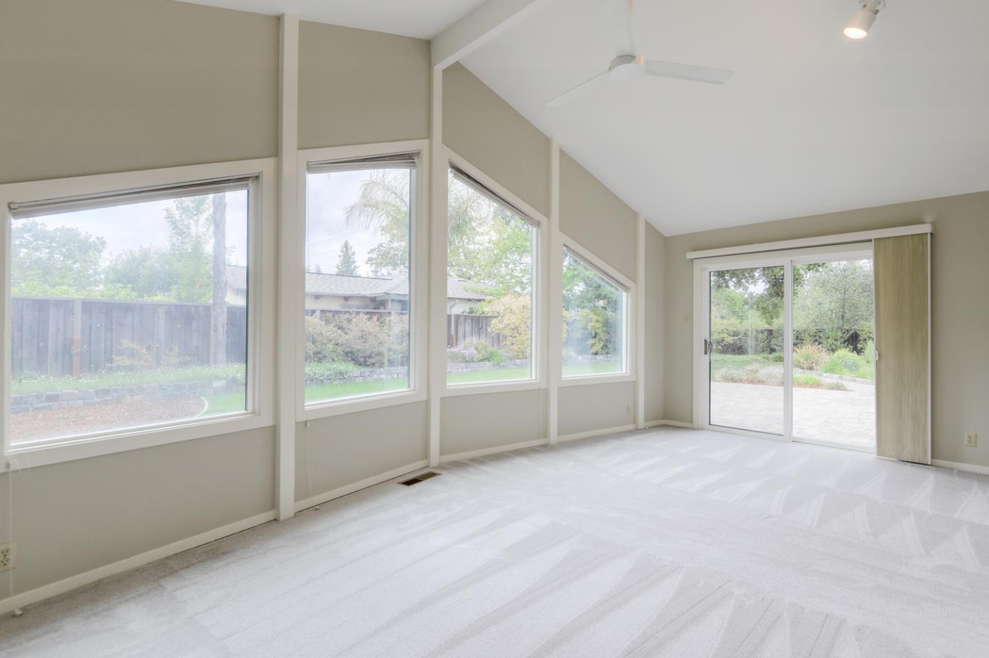 390 Cherry Avenue Los Altos, CA 94022 - Photo 16 of 27 a view of an empty room with wooden floor and a window