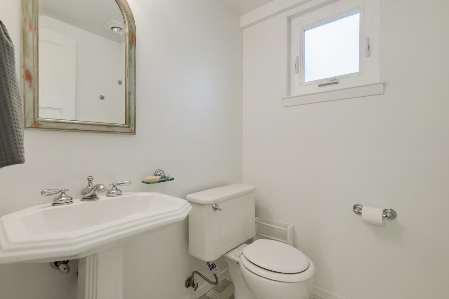 390 Cherry Avenue Los Altos, CA 94022 - Photo 18 of 27 a bathroom with a sink a toilet and mirror