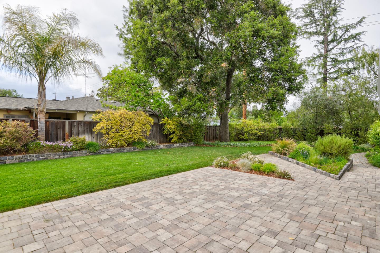 390 Cherry Avenue Los Altos, CA 94022 - Photo 21 of 27 a view of a backyard with palm trees