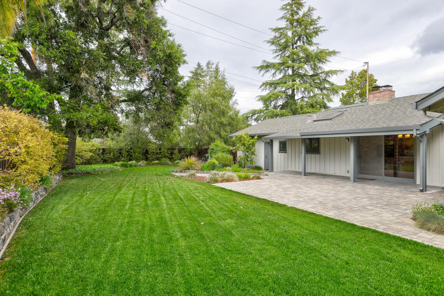 390 Cherry Avenue Los Altos, CA 94022 - Photo 22 of 27 a view of a house with a yard and sitting area