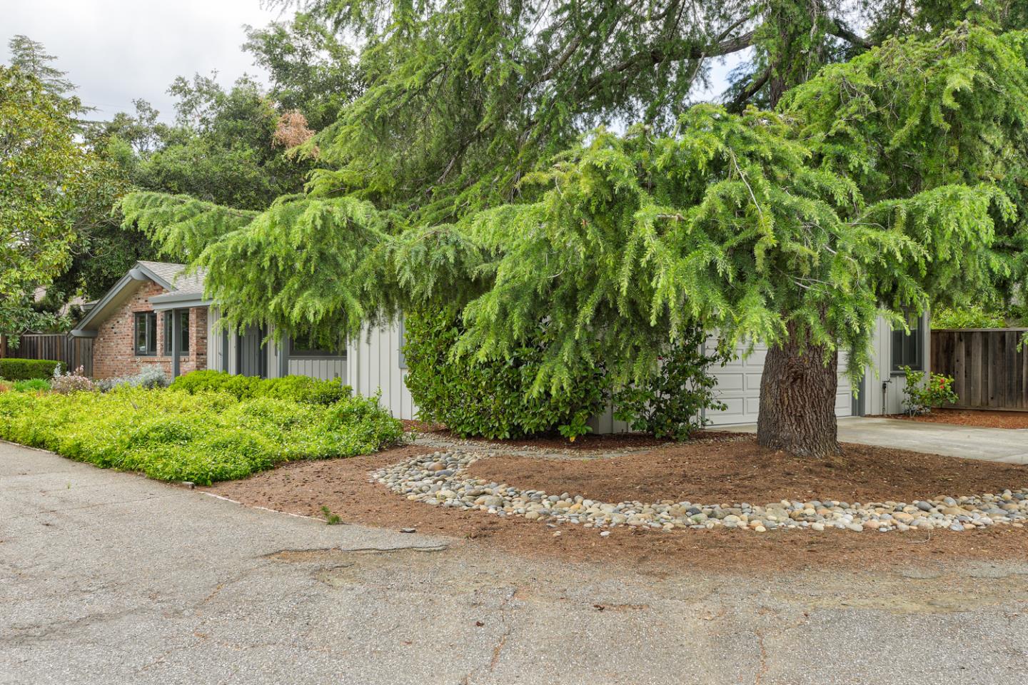 390 Cherry Avenue Los Altos, CA 94022 - Photo 26 of 27 a front view of a house with a yard and a garage