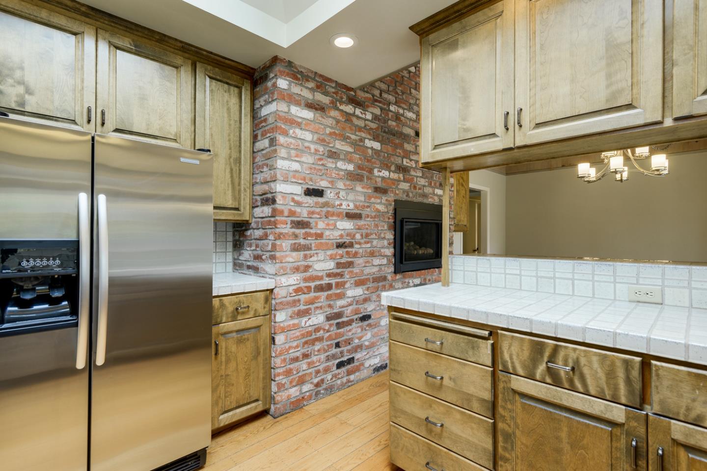 390 Cherry Avenue Los Altos, CA 94022 - Photo 8 of 27 a kitchen with stainless steel appliances granite countertop a refrigerator and a cabinets