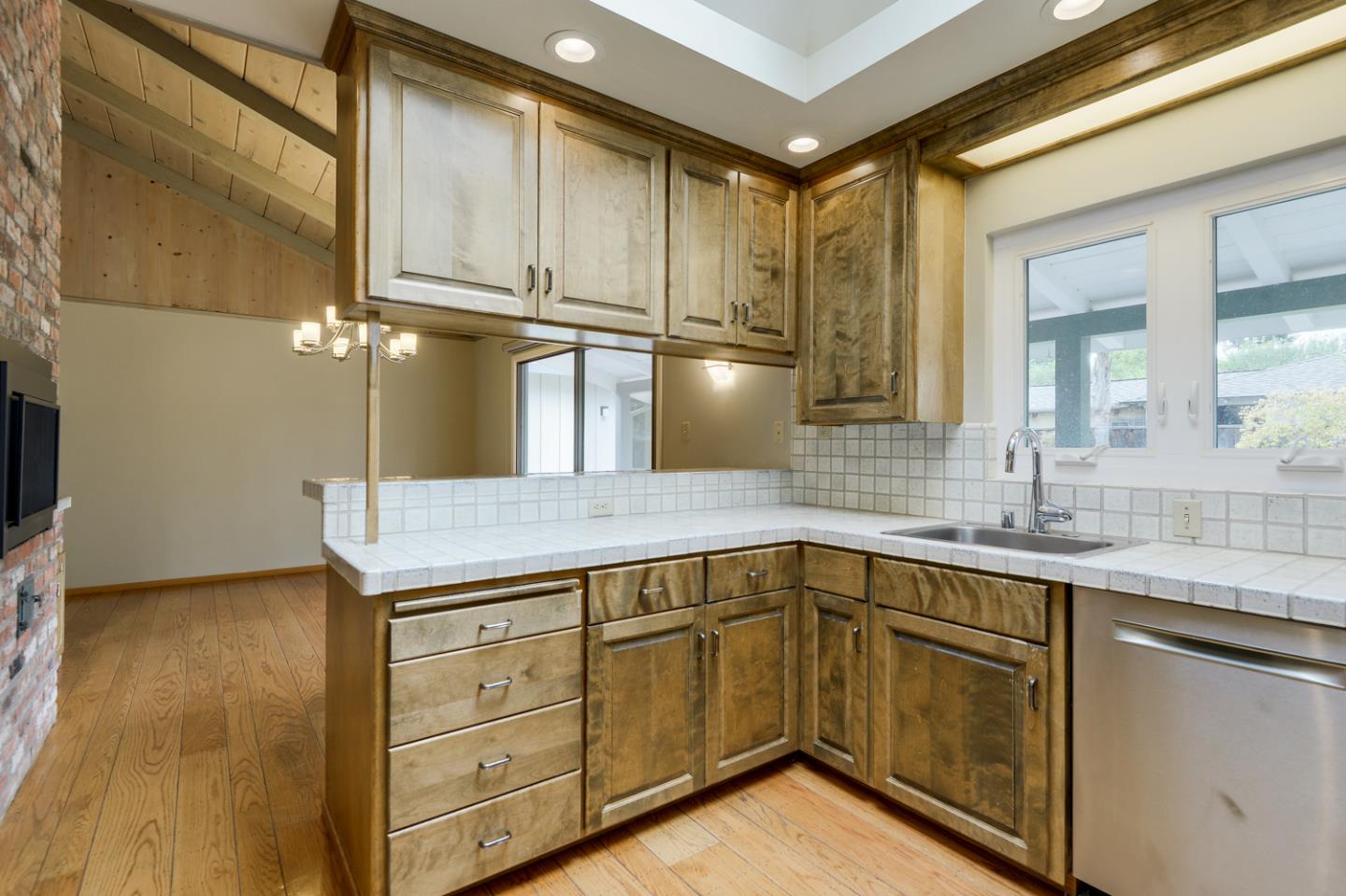 390 Cherry Avenue Los Altos, CA 94022 - Photo 9 of 27 a kitchen with a sink a cabinets and wooden floor