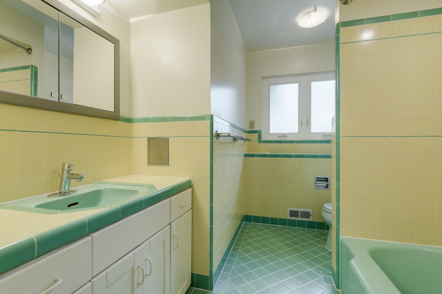 390 Cherry Avenue Los Altos, CA 94022 - Photo 10 of 27 a bathroom with a sink and a mirror