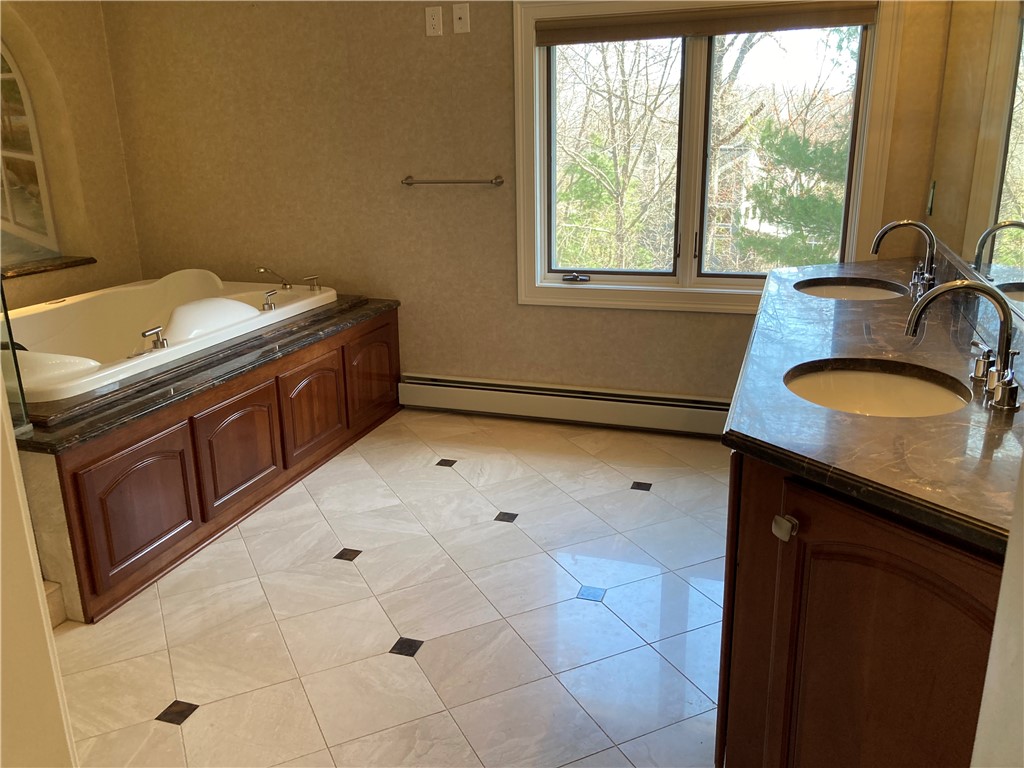 1 Christopher Drive Lincoln, RI 02865 - Photo 23 of 48 Primary Bathroom with double vanities.