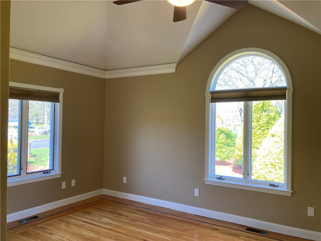 1 Christopher Drive Lincoln, RI 02865 - Photo 32 of 48 The 4th ensuite bedroom on the 1st floor features a cathedral ceiling.