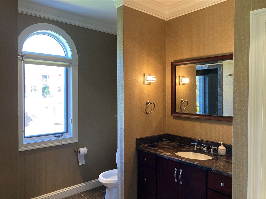 1 Christopher Drive Lincoln, RI 02865 - Photo 33 of 48 The 1st floor, 4th bathroom features a marble walk-in shower.