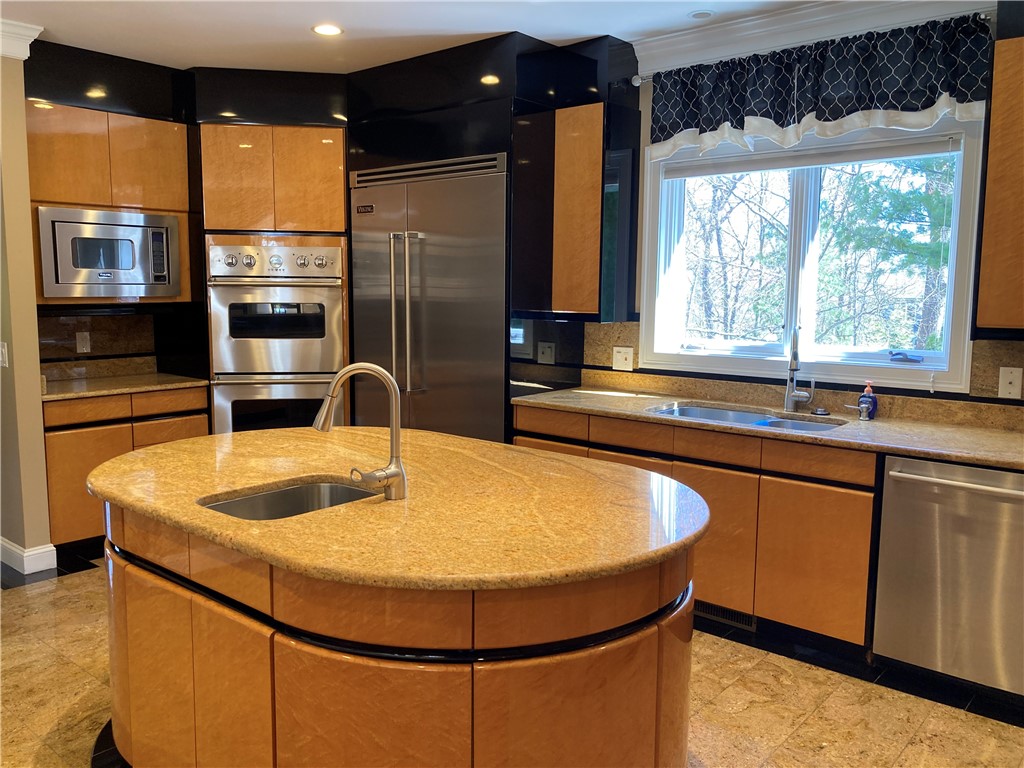 1 Christopher Drive Lincoln, RI 02865 - Photo 7 of 48 The kitchen features specially designed custom cabinets.