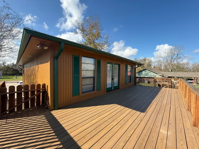 a view of a house with pool wooden floor