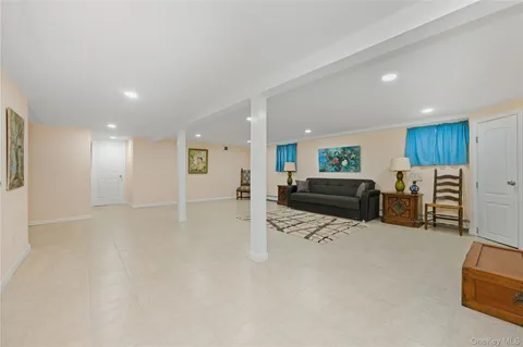 a kitchen with furniture and a refrigerator