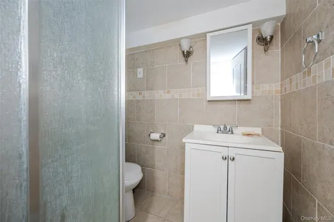 a bathroom with a sink toilet and vanity