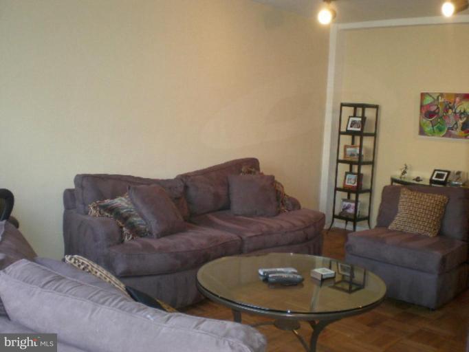 4100 W Street Northwest, Unit 510 Washington, DC 20007 - Photo 3 of 12 a living room with furniture and a table