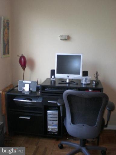 4100 W Street Northwest, Unit 510 Washington, DC 20007 - Photo 6 of 12 a living room with furniture and a flat screen tv