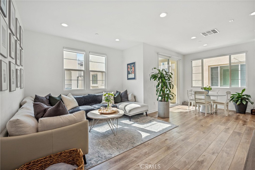 318 Ford Road Costa Mesa, CA 92627 - Photo 4 of 20 a living room with furniture and wooden floor