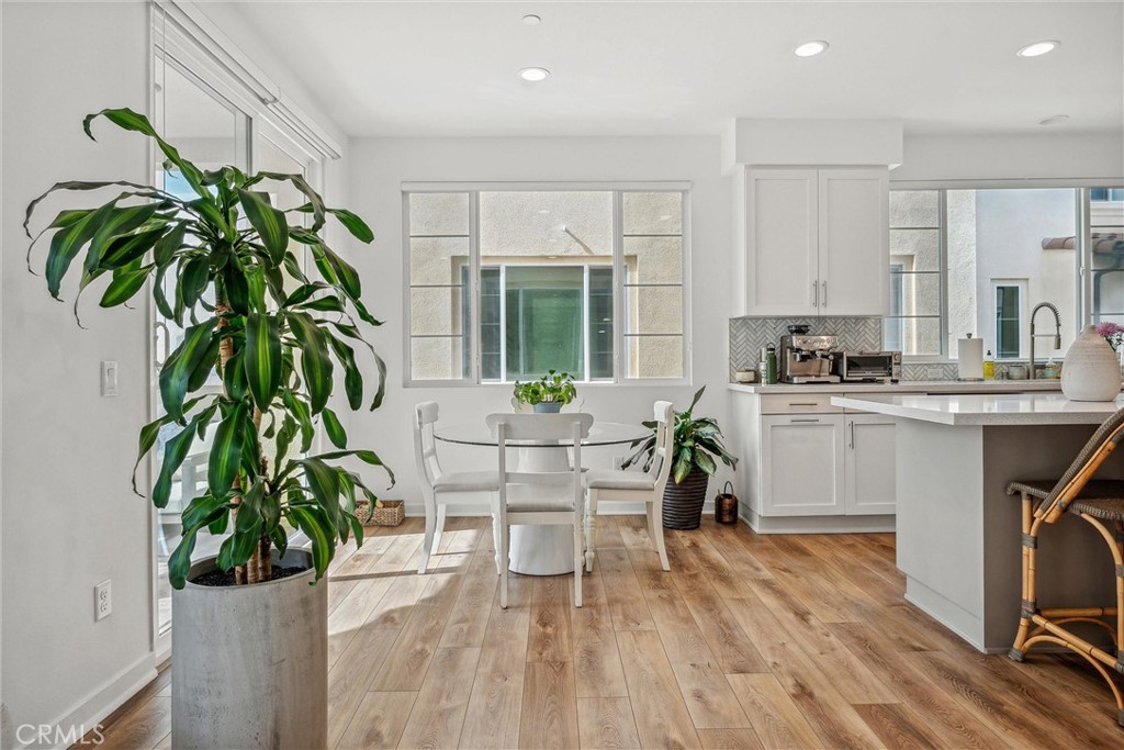 318 Ford Road Costa Mesa, CA 92627 - Photo 5 of 20 a living room with a couch and a potted plant