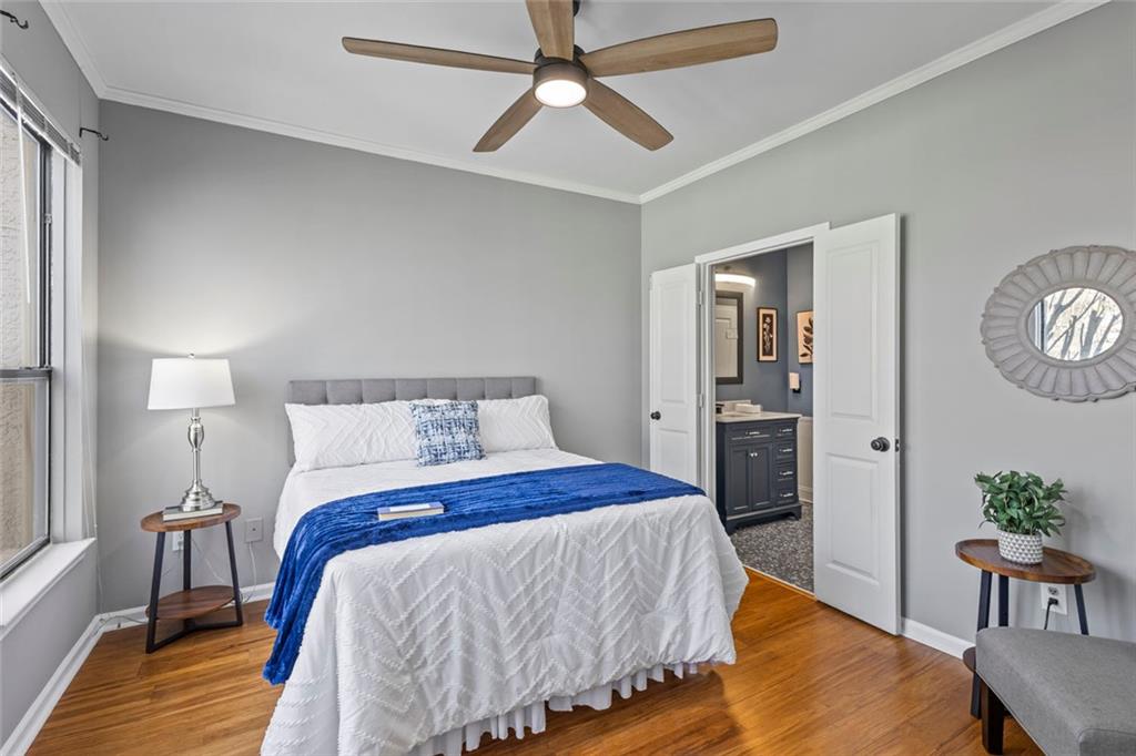 a bed room with a bed and a chandelier