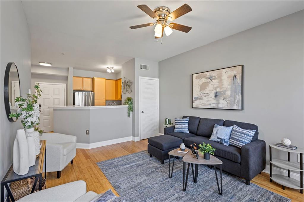 821 Ralph McGill Boulevard Northeast, Unit 3301 Atlanta, GA 30306 - Photo 14 of 31 a living room with furniture a rug and a potted plant