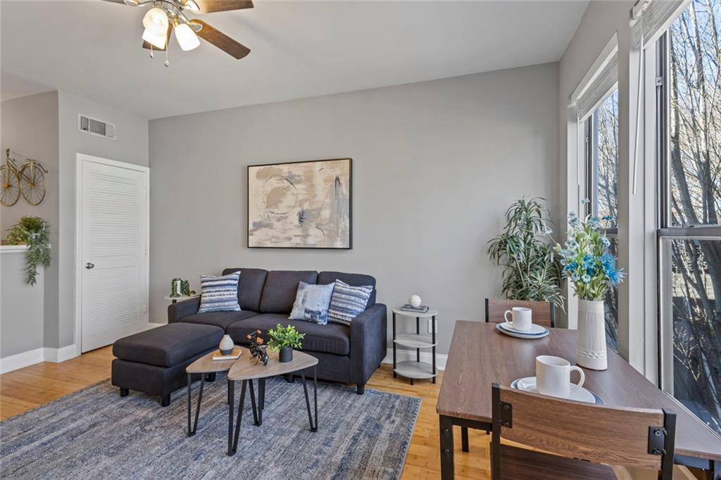 821 Ralph McGill Boulevard Northeast, Unit 3301 Atlanta, GA 30306 - Photo 15 of 31 a living room with furniture and a potted plant
