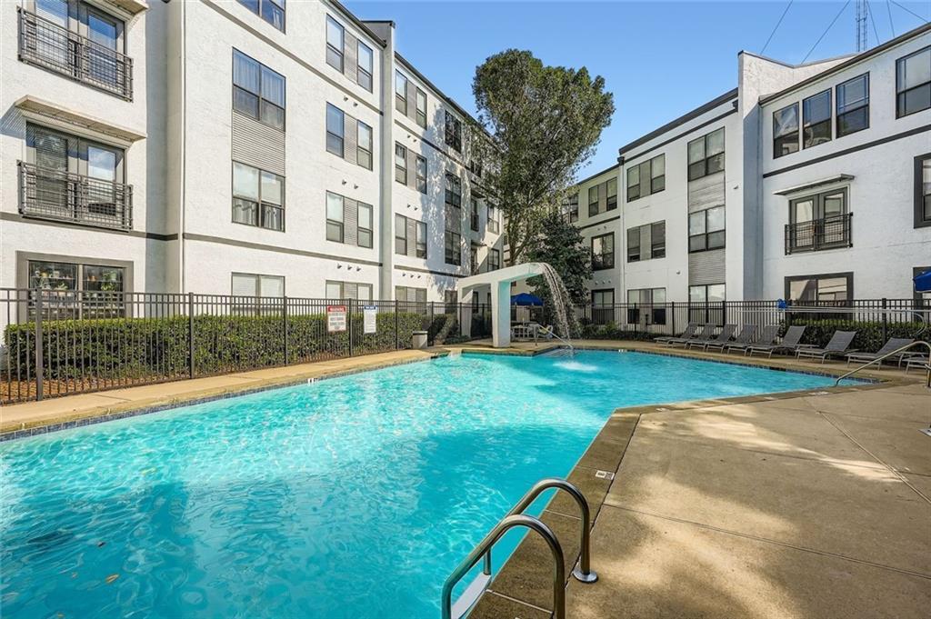 821 Ralph McGill Boulevard Northeast, Unit 3301 Atlanta, GA 30306 - Photo 18 of 31 a view of a house with a backyard