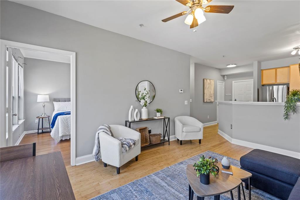 821 Ralph McGill Boulevard Northeast, Unit 3301 Atlanta, GA 30306 - Photo 2 of 31 a living room with furniture and a wooden floor