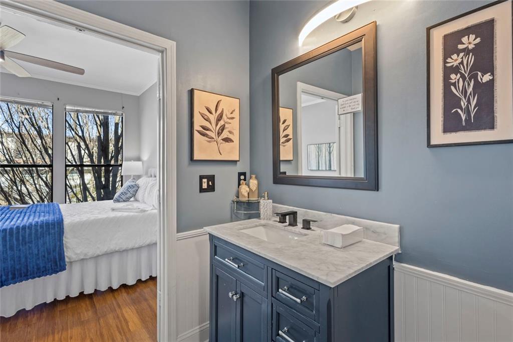 821 Ralph McGill Boulevard Northeast, Unit 3301 Atlanta, GA 30306 - Photo 8 of 31 a bathroom with a sink and a mirror