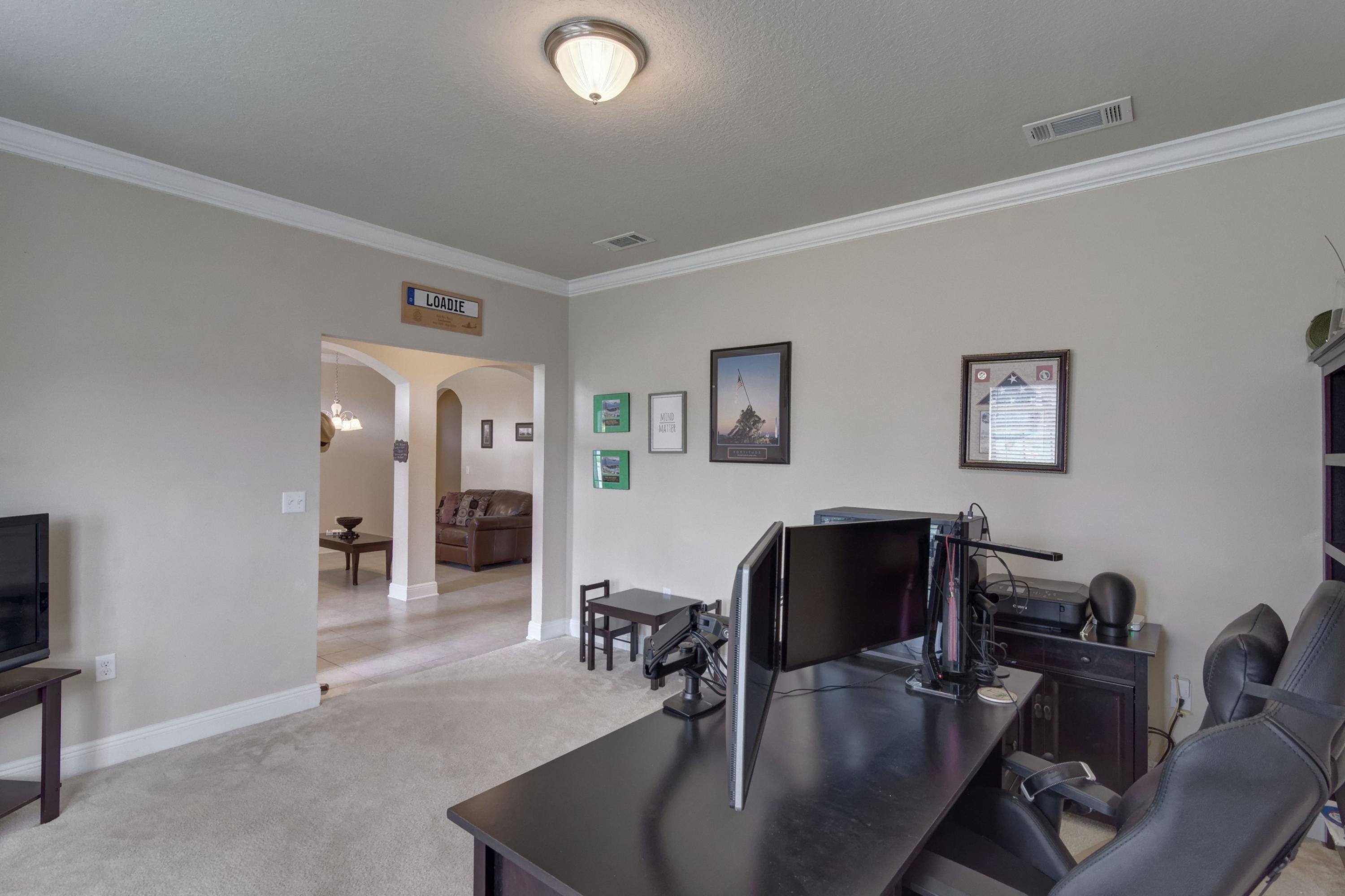 646 Red Fern Road Crestview, FL 32536 - Photo 12 of 64 a living room with furniture and wooden floor