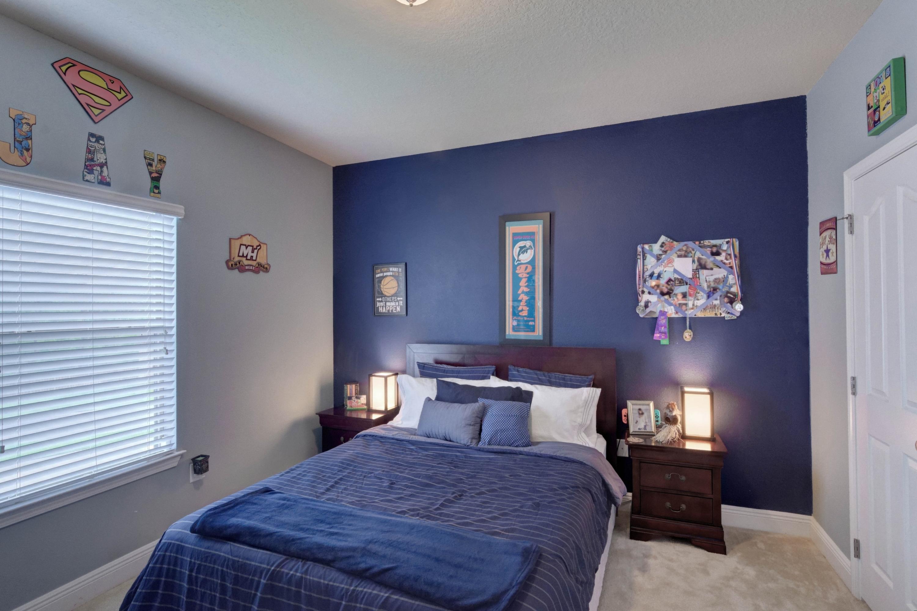 646 Red Fern Road Crestview, FL 32536 - Photo 13 of 64 a bedroom with a bed and a lamp with window