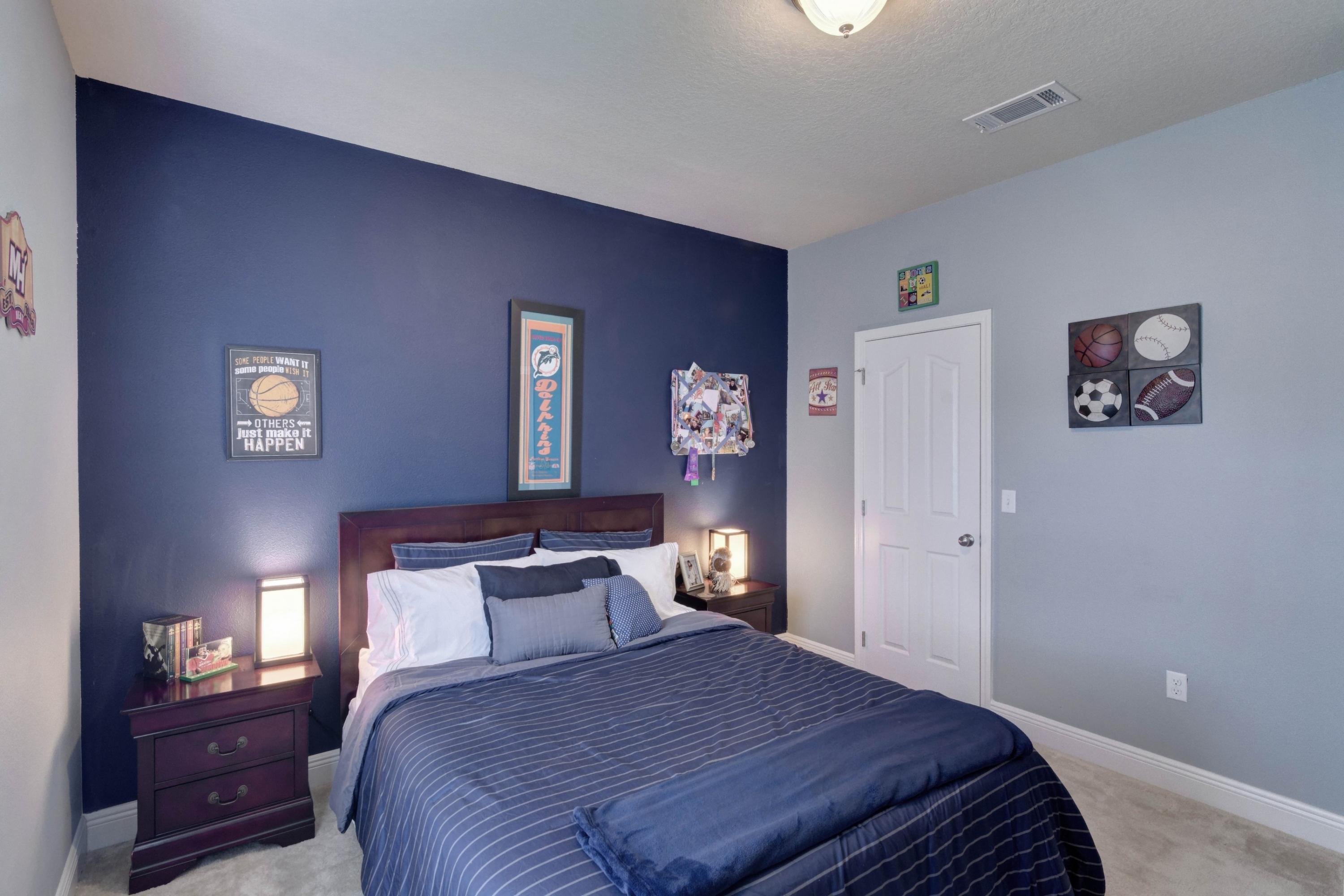 646 Red Fern Road Crestview, FL 32536 - Photo 14 of 64 a bedroom with a bed and a lamp on dresser