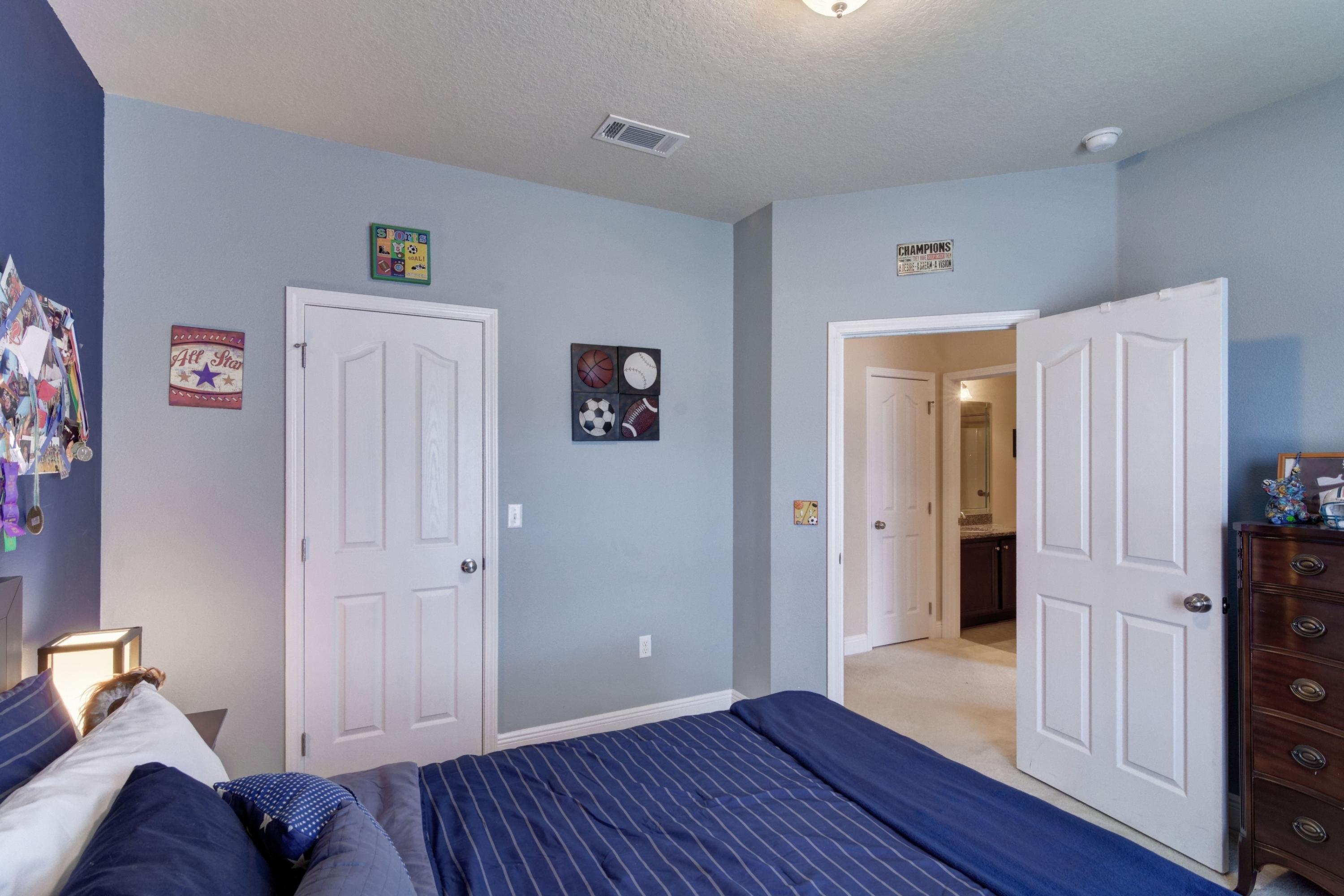 646 Red Fern Road Crestview, FL 32536 - Photo 15 of 64 a view of a bedroom with wooden floor and hallway