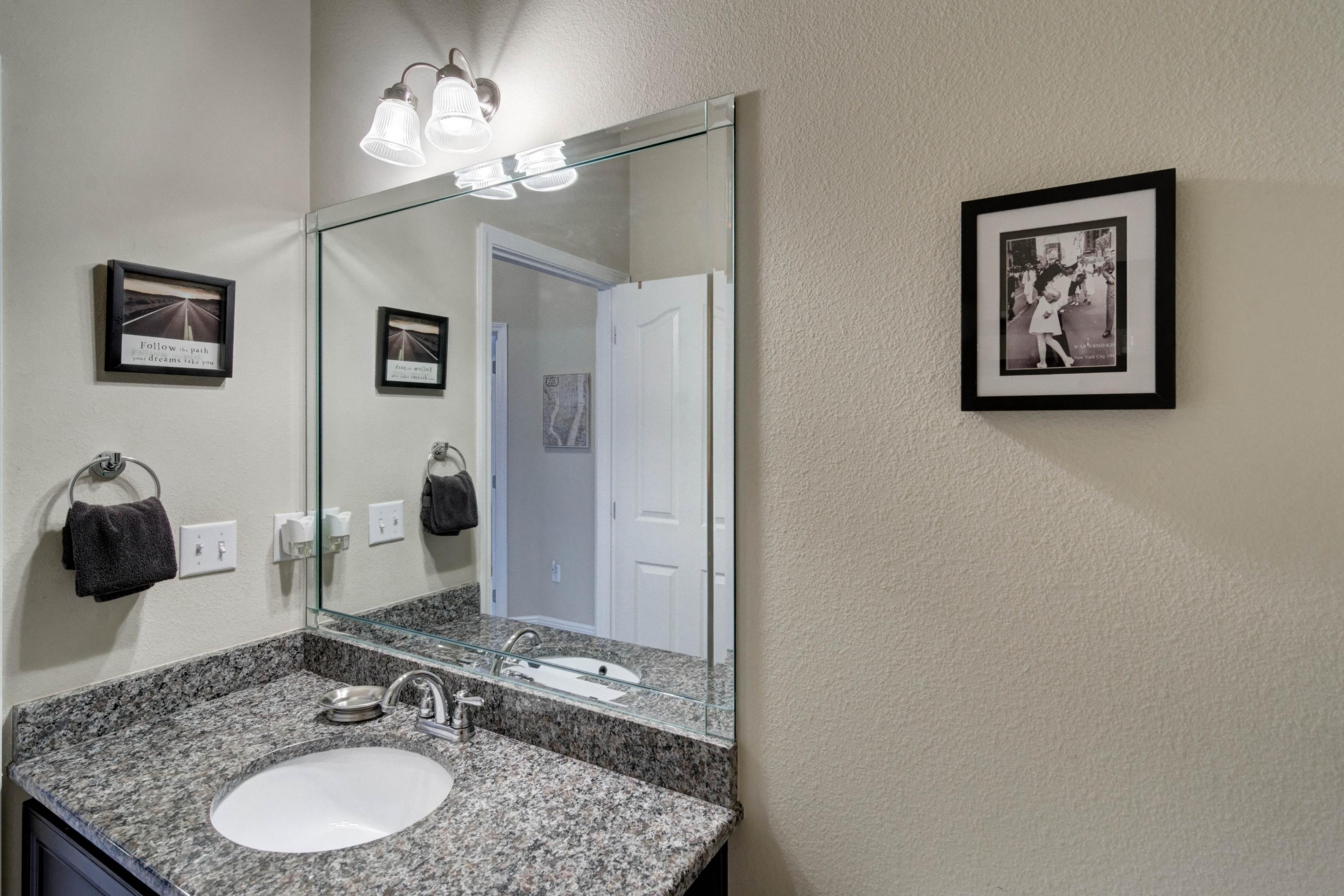 646 Red Fern Road Crestview, FL 32536 - Photo 17 of 64 a bathroom with a granite countertop sink and a mirror