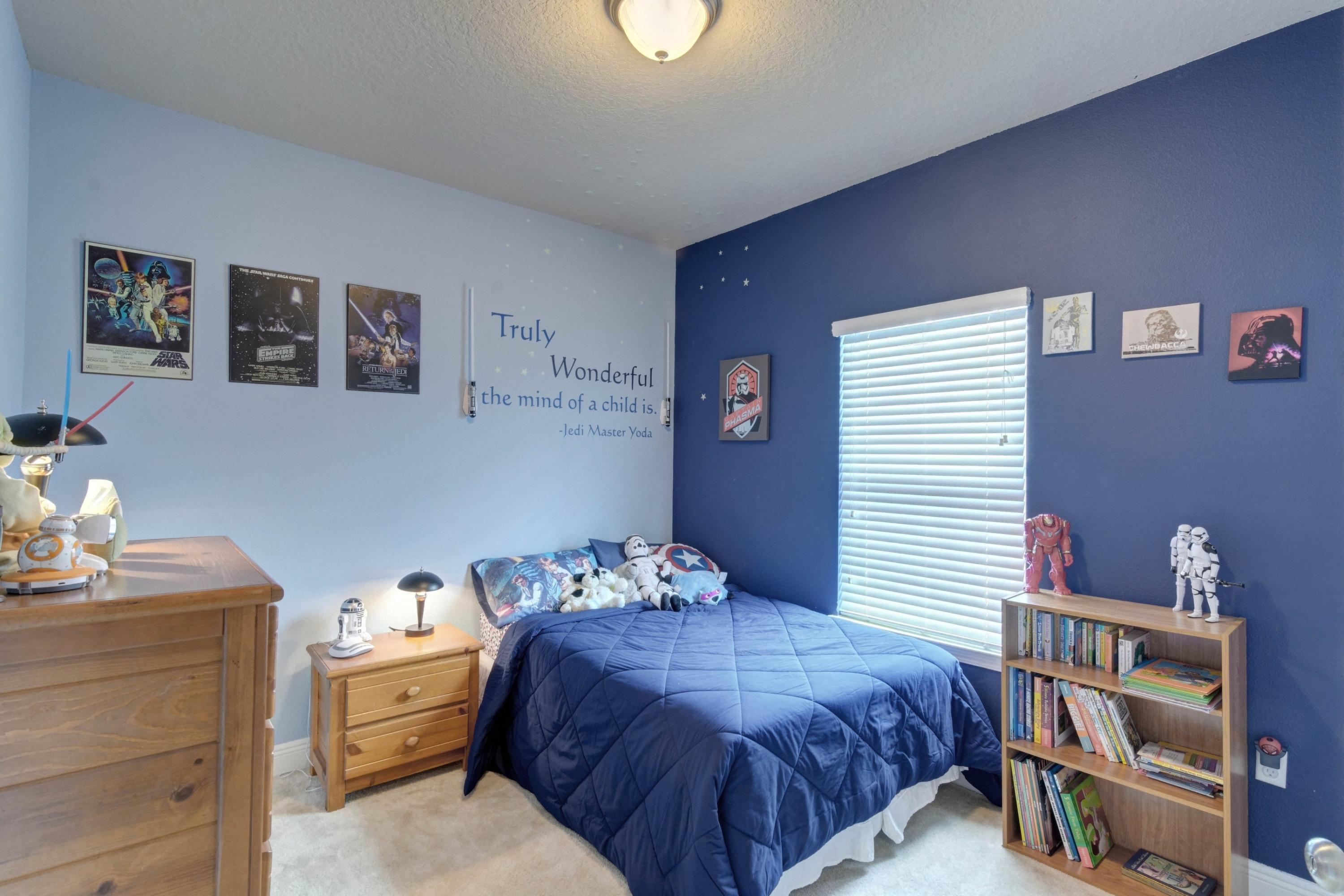 646 Red Fern Road Crestview, FL 32536 - Photo 18 of 64 a bedroom with a bed and a bookshelf