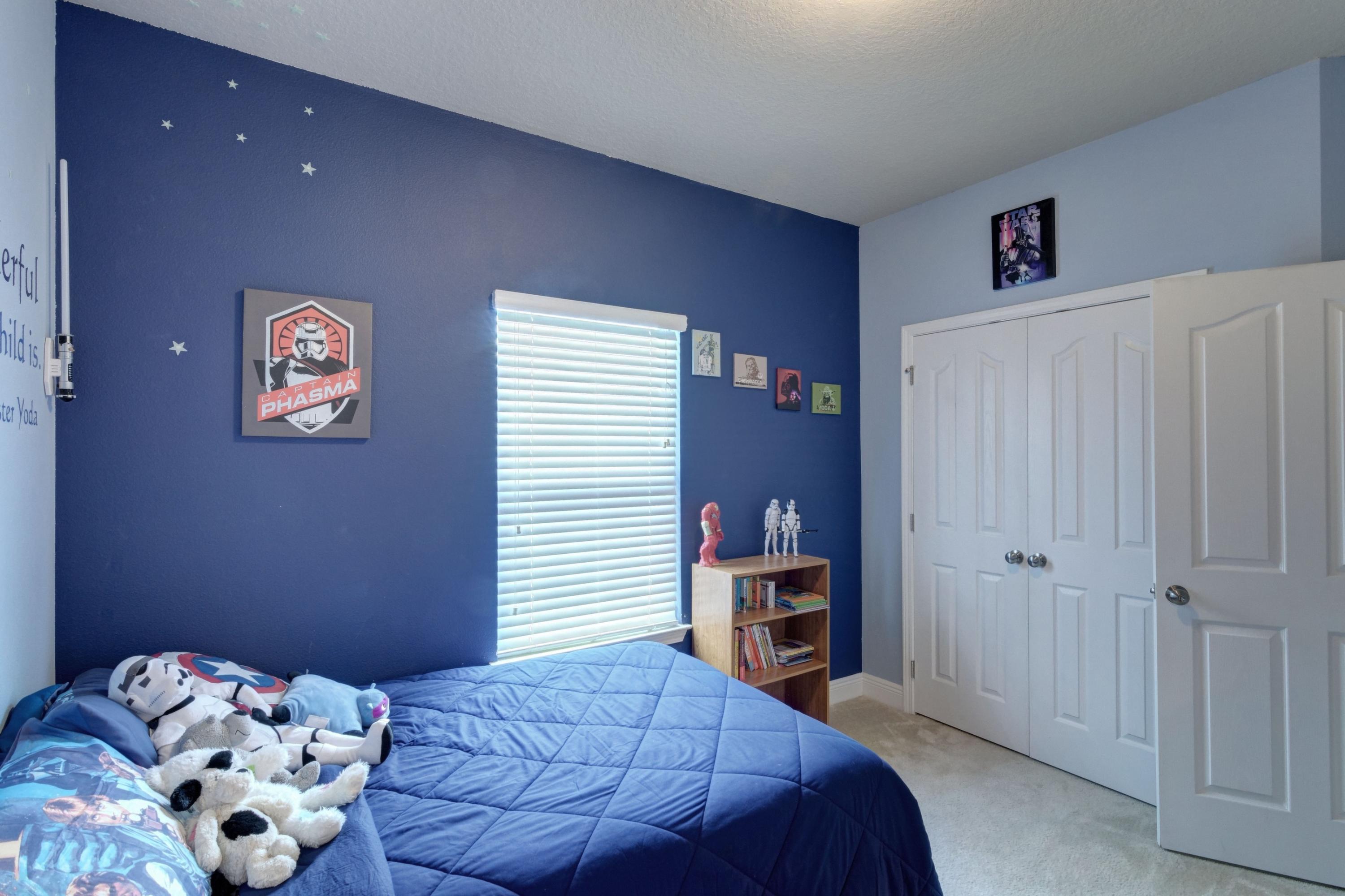 646 Red Fern Road Crestview, FL 32536 - Photo 19 of 64 a bedroom with a bed and a book shelf