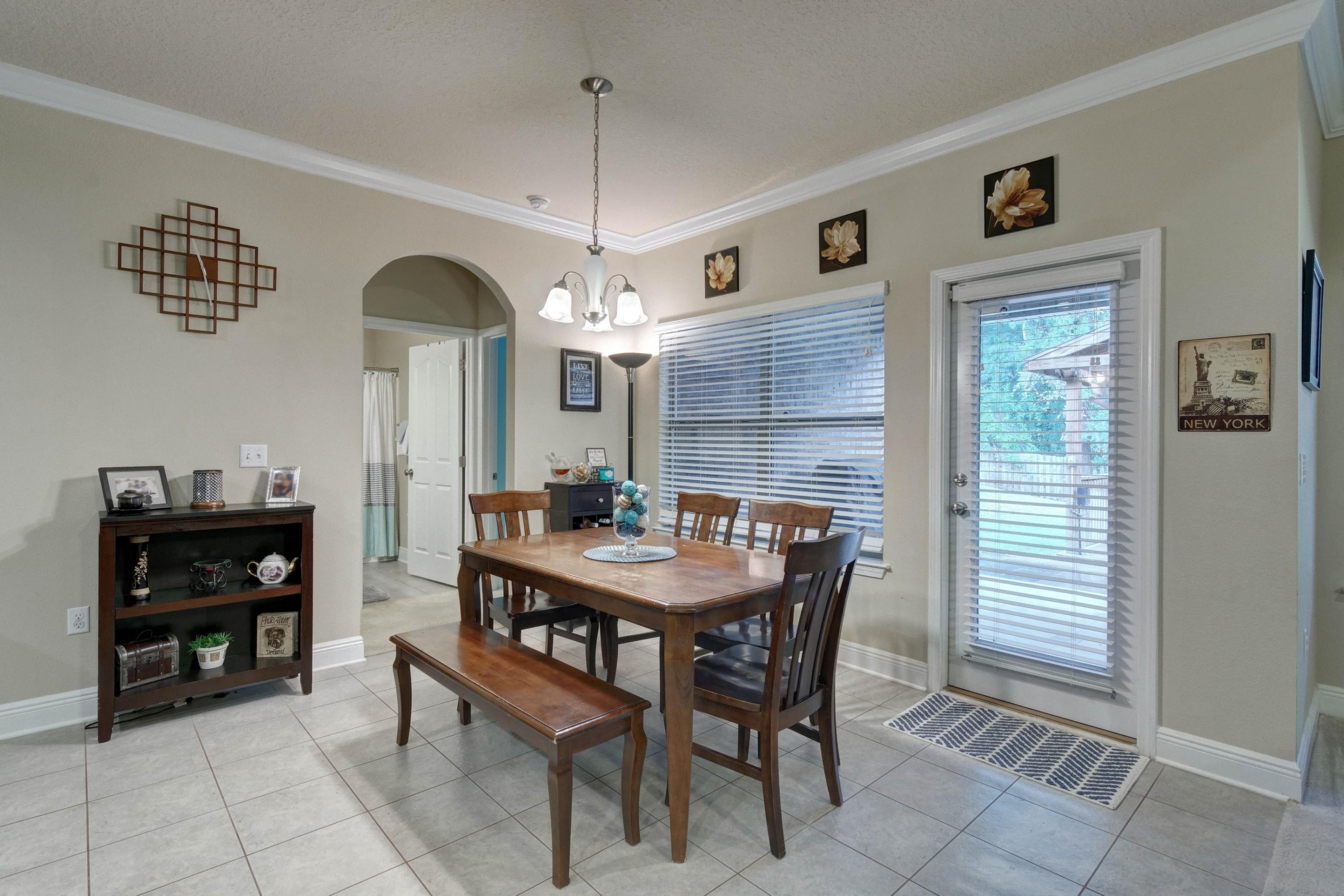 646 Red Fern Road Crestview, FL 32536 - Photo 25 of 64 a view of a dining room with furniture