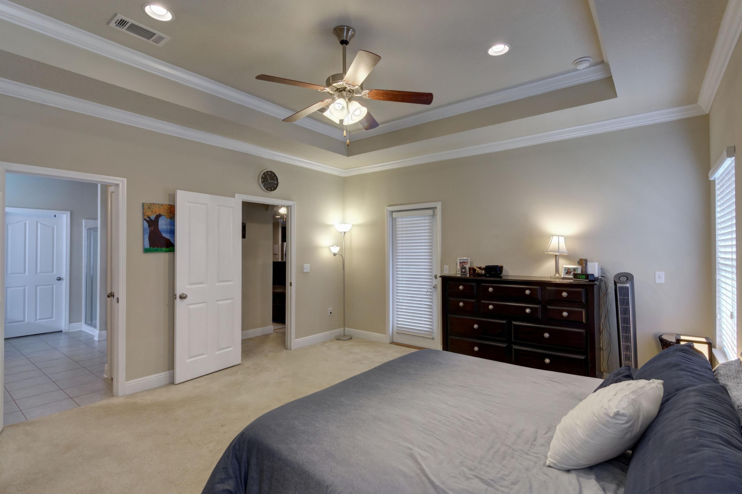 646 Red Fern Road Crestview, FL 32536 - Photo 36 of 64 a bedroom with a bed and ceiling fan